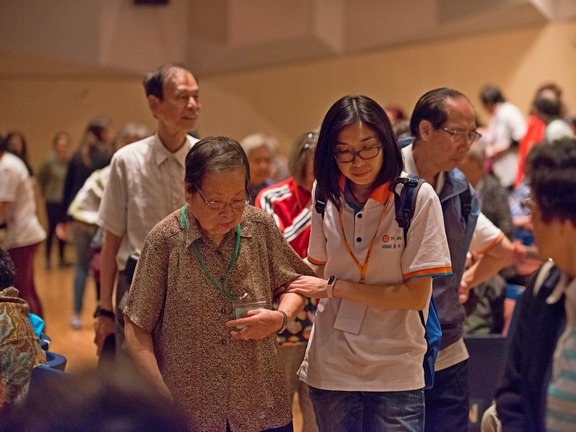 Volunteers take attentive care of the elderly