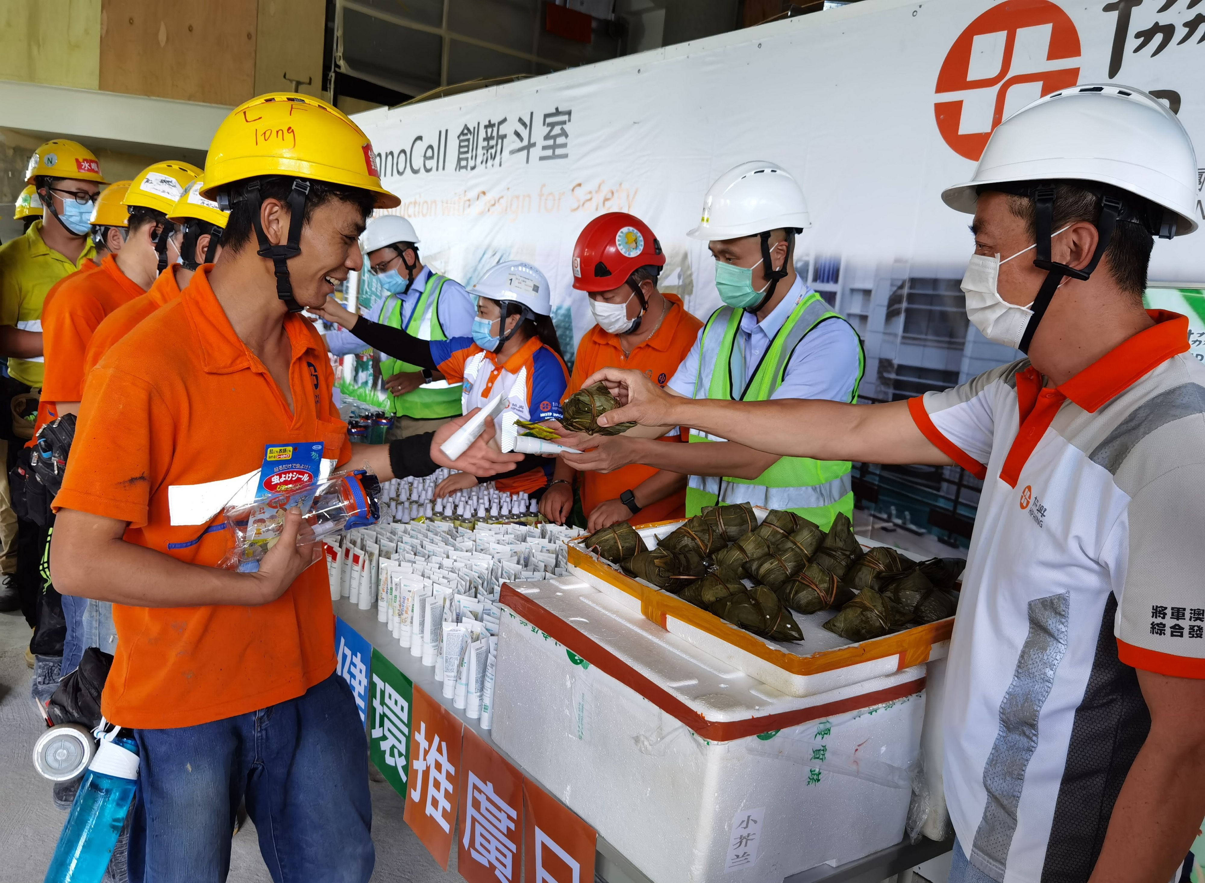 Giving out gifts for workers during festival